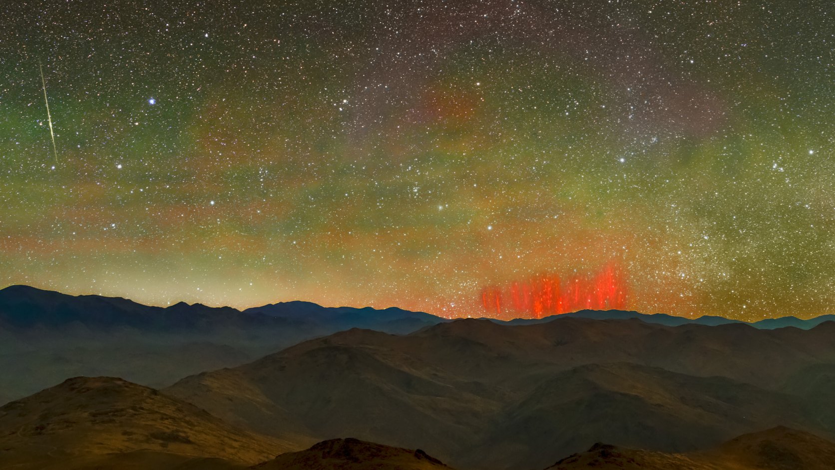 Red sprites above the mountains of Chile's Atacama Desert under a starry sky